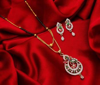 Grab This Designer Heavy Mangalsutra In Golden And Black Color Beautified With Diamond Work. This Mangalsutra Comes With A Set Of Pretty Matching Earrings. It Is Light In Weight And Easy To Carry Throughout The Gala. Buy Now.