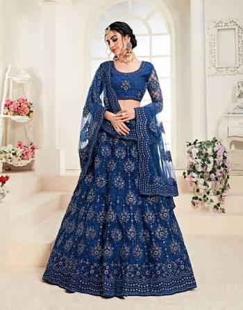 Get Ready For The Upcoming Wedding Season Wearing This Lovely Tone To Tone Heavy Embroidered Lehenga Choli In Royal Blue Color. Its Blouse, Lehenga And Dupatta Are Fabricated On Net Which Comes With Same Colored Satin Silk Inner. Pair This Up With Delicate Pearl Accessories for A Look Like Never Before. 