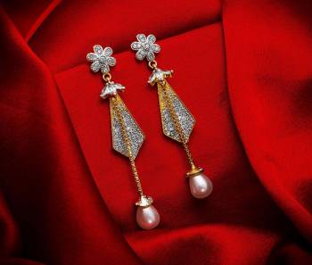 Here Is A Very Pretty Pair Of Simple And Elegant Looking Earring Set In Golden Color. It Has Pretty Unique pattern With Attractive Diamond Work. You can Pair This Even With Simple Attire As Well As A Heavy One. This Pretty Evergreen Design Compliments Any Kind Of Attire You Wear