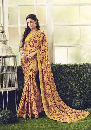 Go For This Lovely Floral Printed Designer Saree In Yellow And Magenta Pink Color Paired With Heavy Embroidered Blouse.  This Pretty Saree And Blouse Are Fabricated On Crepe Which Is Soft Towards Skin And Easy To Carry All Day Long. 