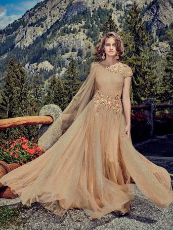 Flaunt Your Rich And Elegant Taste Wearing This Designer Readymade Gown In All Over Beige Color. This Pretty Attractive Gown Is Fabricated Shimmer Net Beautified With Hand Work Paired With Shimmer Net Fabricated Dupatta. Buy Now.