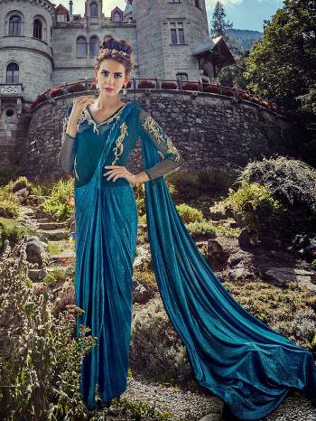 Grab This Very Pretty Readymade Gown Saree In Blue Color. It Is Ready To Wear Saree Like A Gown Which Has Attatched Blouse And Pallu. This Pretty Piece Is Lycra Based Which Is Comfortable to Carry Throughout The Gala.