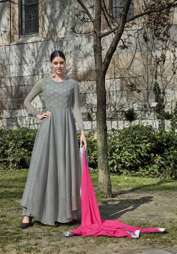 Flaunt Your Rich And Elegant Taste Wearing This Pretty Designer Suit In Grey Colored Top and Bottom Paired With Contrasting Pink Colored Dupatta. Its Elegant Top Is Fabricated On Georgette Paired With Santoon Bottom And Chiffon Fabricated Dupatta. 