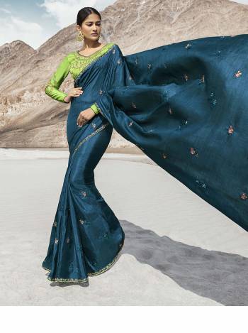Attract All Wearing This Desiger Saree In Blue Color Paired With Contrasting Parrot Green Colored Heavy Embroidered Blouse. This Saree Is Fabricated on Soft Silk Paired With Art Silk Fabricated Blouse. 