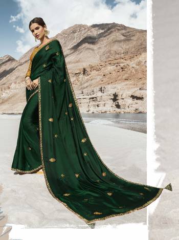 Catch All The Limelight At The Function You Attend Wearing This Designer Saree With Heavy Blouse Concept. This Rich Silk Based Saree IS In Dark Green Color Paired With Contrasting Musturd Yellow Colored Blouse. Buy Now.