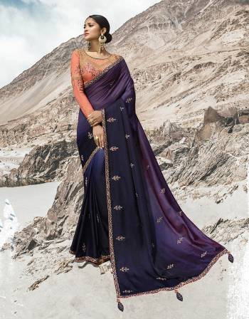 Attract All Wearing This Desiger Saree In Dark Purple Color Paired With Contrasting Orange Colored Heavy Embroidered Blouse. This Saree Is Fabricated on Soft Silk Paired With Art Silk Fabricated Blouse. 