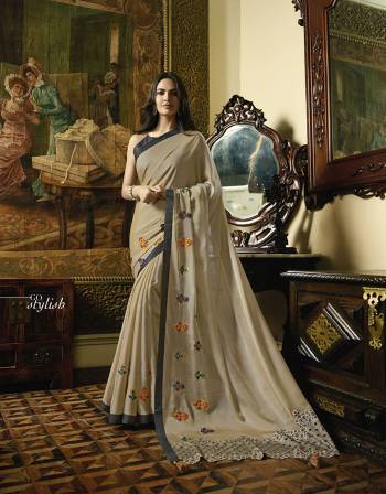 Flaunt Your Rich And Elegant Taste Wearing This Designer Saree In Cream Color Paired With Black Colored Blouse. This Pretty Elegant Embroidered Saree Is Fabricated On Satin Georgette Paired With Art Silk Fabricated Blouse. Its Rich Color and Fabric Will Earn You Lots Of Compliments From Onlookers.