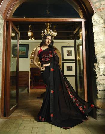 For A Bold And Beautiful Look, Grab This Beautiful Designer Saree In Black Color Paired With Red Colored Blouse. This Saree Is Fabricated On Georgette Paired With Art Silk Fabricated Blouse. Buy This Lovely Saree Now.