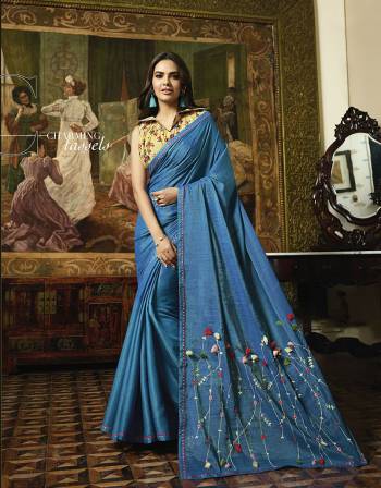 Celebrate This Festive Season Wearing This Pretty Designer Saree In Blue Color Paired With Contrasting Yellow Colored Blouse. This Saree And Blouse Are Silk Based Which Gives A Rich Look To Your Personality. 