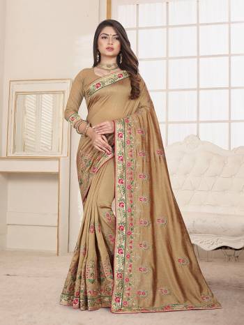 Here Is An Attractive Looking Heavy Designer Saree In Beige Color Paired With Beige Colored Blouse. This Saree And Blouse Are Fabricated On Art Silk Beautified With Coloful Resham Embroidery With Jari & Coding Work, Buy Now.