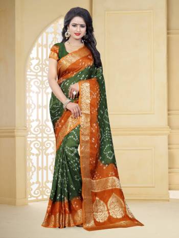 Grab This Pretty Designer Bandhani Saree In Green And Rust Orange Color. This Saree And Blouse Are Fabricated On Art Silk Beautified With Prints And Weaved Lace Border. It Is Light In Weight And Easy To Carry All Day Long