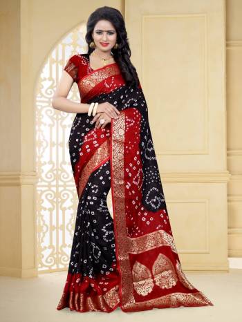 Grab This Pretty Designer Bandhani Saree In Black And Red Color. This Saree And Blouse Are Fabricated On Art Silk Beautified With Prints And Weaved Lace Border. It Is Light In Weight And Easy To Carry All Day Long