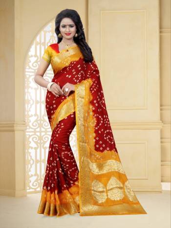 Grab This Pretty Designer Bandhani Saree In Red And Yellow Color. This Saree And Blouse Are Fabricated On Art Silk Beautified With Prints And Weaved Lace Border. It Is Light In Weight And Easy To Carry All Day Long
