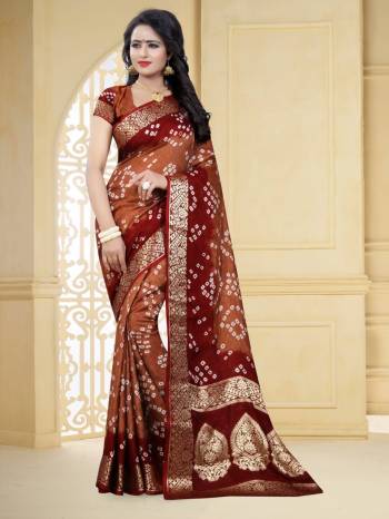 Grab This Pretty Designer Bandhani Saree In Brown & Red Color. This Saree And Blouse Are Fabricated On Art Silk Beautified With Prints And Weaved Lace Border. It Is Light In Weight And Easy To Carry All Day Long