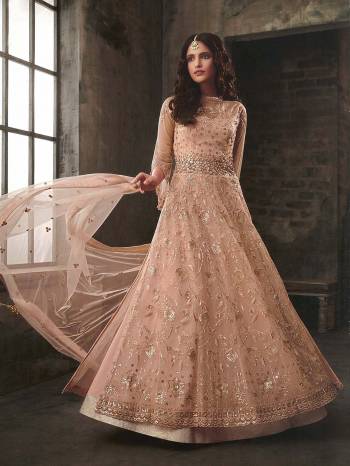 Look Pretty Wearing This Designer Indo-Western Suit All Over Peach Color. This Lovely Suit Comes With Two Bottoms. Its Top Is Fabricated On Net With Heavy Detailed Embroidery Paired With Art Silk Lehenga , Santoon Bottom And Net Fabricate Dupatta. Its Lovely Color And Detailed Embroidery Will Earn You Lots Of Compliments From Onlookers. 