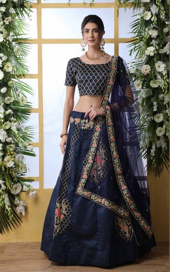 Enhance Your Personality Wearing This Heavy Designer Lehenga Choli In All Over Navy Blue Color. This Lehenga And Choli Are Fabricated On Art Silk Paired With Net Fabricated Dupatta. It Is Beautified With Attractive Jari And Thread Work. 