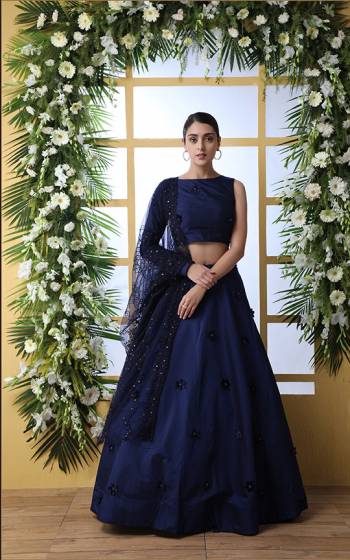 Enhance Your Personality Wearing This Heavy Designer Lehenga Choli In All Over Navy Blue Color. This Lehenga And Choli Are Fabricated On Tefata Art Silk Paired With Net Fabricated Dupatta. It Is Beautified With Tone To Tone Embroidery And 3D Flower Detailings. 