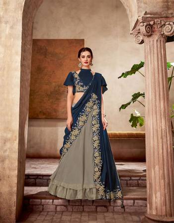 Induce an aura of high-fashion glamour while keeping the traditions at bay in this one-of-a-kind double pallu style lehenga saree embellished with ribbon embroidery details. 