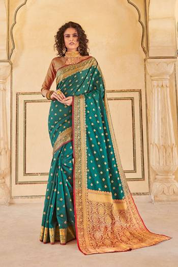 Classy Saree look pretty like never before.Wearing this Teal Green Color Saree which made from Handloom Silk With Maroon & Golden Color Handloom Silk blouse, Saree has also decorative work like Heavy Jacquard Work With Pallu.This beautiful Saree features a classy Jacquard Work all over,which makes it a smart pick for all occasions. 