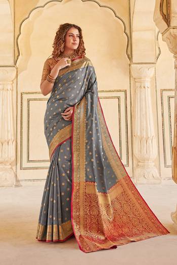Classy Saree look pretty like never before.Wearing this Grey Color Saree which made from Handloom Silk With Maroon & Golden Color Handloom Silk blouse, Saree has also decorative work like Heavy Jacquard Work With Pallu.This beautiful Saree features a classy Jacquard Work all over,which makes it a smart pick for all occasions. 