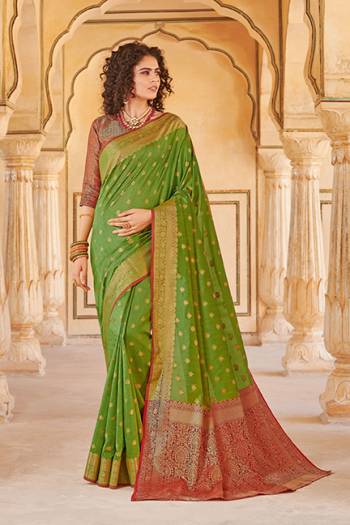Classy Saree look pretty like never before.Wearing this Parrot  Green Color Saree which made from Handloom Silk With Maroon & Golden Color Handloom Silk blouse, Saree has also decorative work like Heavy Jacquard Work With Pallu.This beautiful Saree features a classy Jacquard Work all over,which makes it a smart pick for all occasions. 