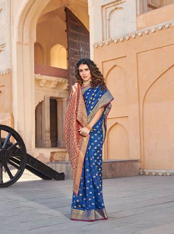 Classy Saree look pretty like never before.Wearing this Blue Color Saree which made from Handloom Silk With Maroon & Golden Color Handloom Silk blouse, Saree has also decorative work like Heavy Jacquard Work With Pallu.This beautiful Saree features a classy Jacquard Work all over,which makes it a smart pick for all occasions. You can wear this Saree in different styles.