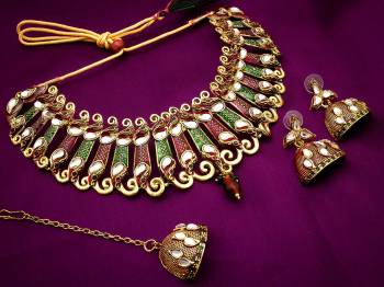 This Wedding Season Give Your Attire More Heavy And Elegant Look?Pairing It With This Attractive Heavy Necklace Set In Golden Comes With A Pair Of Earrings And A Maang Tika. This Can Be Paired With Any Colored Traditional Attire. Buy Now.?