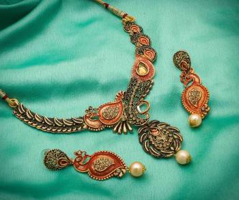 Give An Enhanced Look To Your Personality By Pairing Up This Beautiful Necklace Set With Your Ethnic Attire. This Pretty Set Is In Golden Color Beautified With Stone And Pearl Work. Buy Now