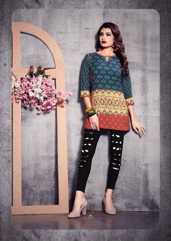 Add Some Casuals With This Readymade Short Kurti In Blue And Multi Color Fabricated On Poly Rayon. It IS Beautified With Prints Which Is Light Weight And Easy To Carry All Day Long.