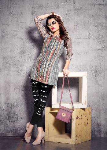 Simple and Elegant Looking Short Kurti Is Here In Grey Color. This?Readymade Kurti In Poly Rayon Based Beautified With Prints All Over. Buy Now.