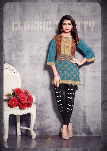 Simple and Elegant Looking Short Kurti Is Here In Blue And Brown Color. This?Readymade Kurti In Poly Rayon Based Beautified With Prints All Over. Buy Now.