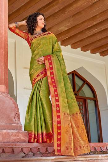 Classy Saree look pretty like never before.Wearing this Green Color Saree which made from Silk With Red Color Silk blouse, Saree has also decorative work like Heavy Jacquard Work With Pallu.This beautiful Saree features a classy Jacquard Work all over,which makes it a smart pick for all occasions.