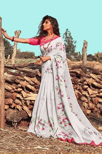 Flaunt Your Rich And Elegant Taste Wearing This Designer Saree In Grey Color Paired With Contrasting Dark Pink Colored Blouse. This Saree and Blouse are Fabricated on Linen Beautified With Pretty Floral Prints. 