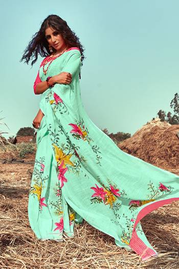 You Will Definitely Earn Lots Of Compliments Drapiing This Lovely Designer Saree In Sea Green Color Paired With Contrasting Dark Pink Colored Blouse. This Saree And Blouse Are linen Based Beautified With Floral Prints. Buy This Pretty Saree Now.