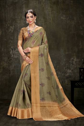 Look Pretty In This Printed Designer Saree In Olive Green Color Paired With Beige Colored Blouse. This Saree And Blouse Are Fabricated on Cotton Silk Beautified With Attractive Jacquard Silk Border. Buy Now.