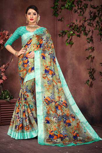 Look Pretty In This Multi Colored Saree Paired With Sky Blue Colored Blouse. This Saree And Blouse Are Fabricated On Cotton Silk Beautified With Prints And Satin Border. 