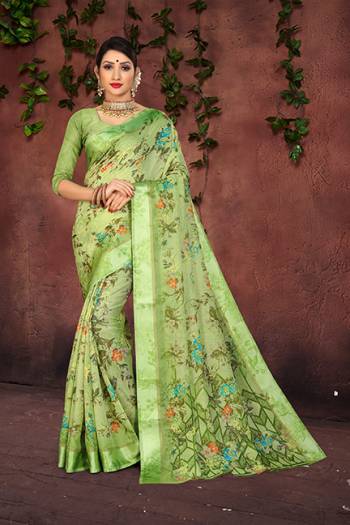 Grab This Pretty Saree In Light Green Color For Your Semi-Casual And Festive Wear. This Saree And Blouse Are Fabricated On Cotton Silk Beautified With Pretty Prints And Attractive Satin Border. 