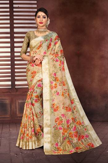 Celebrate This Festive Season With Beauty And Comfort Wearing This Light Weight Designer Saree In Beige Color Paired With Beige Colored Blouse, This Saree And Blouse Are Fabricated On Cotton Silk Beautified With Prints All Over And Satin Border. Buy Now.