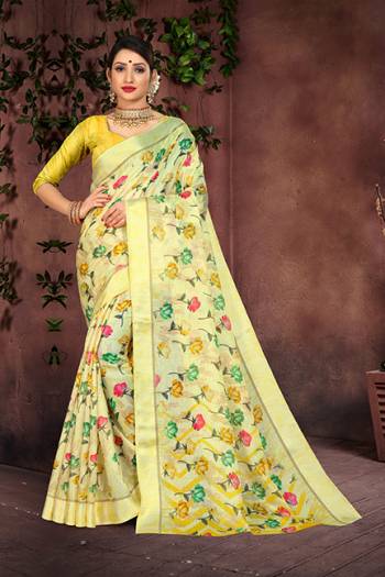 Look Pretty In This Light Yellow Colored Saree Paired With Yellow  Colored Blouse. This Saree And Blouse Are Fabricated On Cotton Silk Beautified With Prints And Satin Border. 