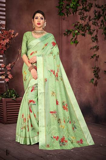 Grab This Pretty Saree In Light Green Color For Your Semi-Casual And Festive Wear. This Saree And Blouse Are Fabricated On Cotton Silk Beautified With Pretty Prints And Attractive Satin Border. 