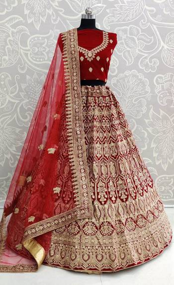 Get Ready For Your D-Day With This Heavy Designer Lehenga Choli In Maroon Color. This Heavy Embroidered Lehenga Choli Is Fabricated On Velvet Paired With Net Fabricated Dupatta. It Is Beautified With Heavy Jari Embroidery And Stone Work. Buy This Bridal Lehenga Now