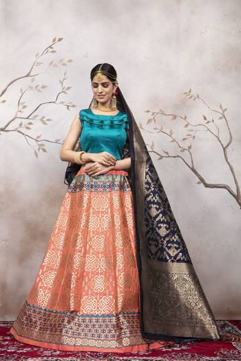 Here Is A Very Beautiful Silk Based Designer Lehenga Choli In Blue Colored Blouse Paired With Peach Colored Lehenga And Navy Blue Colored Dupatta. This Lehenga Choli Is Silk based Giving A Rich And Elegant Llook To Your Personality.