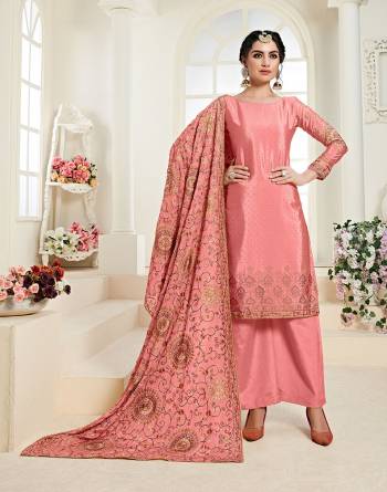 You Will Definitely Earn Lots Of Compliments Wearing This Heavy Designer Straight Suit In Pink Color. Its Top and Dupatta Are Fabricated On Chinon Beautified With Heavy Attractive Embroidery Paired With Santoon Bottom. 