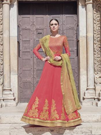 Grab This Beautiful Designer Floor Length Suit In Dark Peach Colored Top And Bottom Paired With Light Green Colored Dupatta. Its Embroidered Top Is Fabricated On Georgette Paired With Satin Bottom And Net Fabricated Heavy Embroidered Dupatta. Buy This Pretty Suit Now.