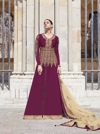 Look Pretty In This Lovely Suit For The Upcoming Wedding And Festive Season In Wine Color Paired With Contrasting Cream Colored Dupatta. Its Top Is Fabricated On Georgette Paired With Satin Bottom And Net Fabricated Dupatta. Its Top And Dupatta Are Beautified With Heavy Embroidery Giving An Attractive Look. 