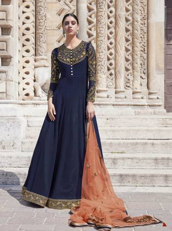 Celebrate This Festive Season Wearing This Heavy Designer Floor Length Suit In Navy Blue Color Paired With Orange Colored Dupatta. Its Top Is Georgette Based Paired With satin Bottom And Net Fabricated Dupatta. Buy This Lovely Semi-Stitched Suit Now.