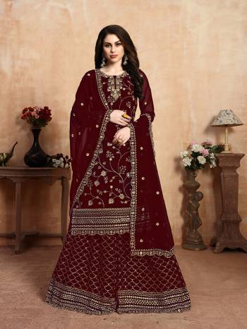 Add This Very Beautiful Heavy Designer Sharara Suit To your Wardrobe In Maroon Color. This Heavy Embroidered Suit Is Fabricated On Georgette. It Is Light In Weight And Easy To Carry All Day Long. 