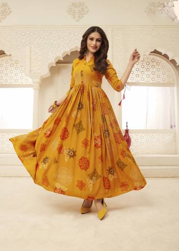 Here Is A Very Pretty Designer Readymade Gown In Musturd Yellow Color Fabricated on Rayon. This Gown Is Beautified With Prints And It Is Soft Towards Skin Which Is Easy To Carry All Day Long. 