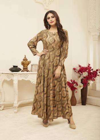 Flaunt Your Rich And Elegant Taste Wearing This Designer Readymade Elegant Looking Gown In Rich Beige Color. This Gown Is Rayon Based Beautified With Prints All Over. Its Fabric Ensures Superb Comfort all Day Long, Buy Now.