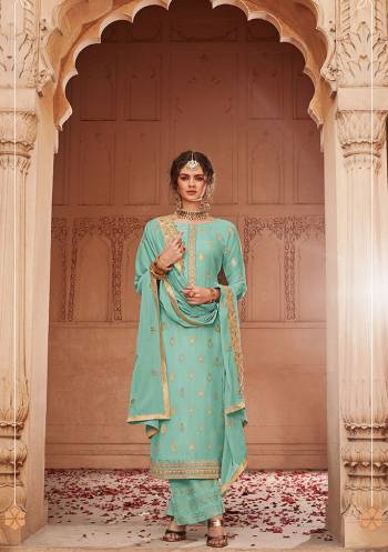 Add This Very Pretty Semi-Stitched Suit To Your Wardrobe In Tuquoise Blue Color. This Heavy Designer Suit Is Fabricated On Jacquard Silk Paired With Santoon Bottom And Chinon Fabricated Dupatta. Its Top and Dupatta are Beautified With Heavy Embroidery Giving You An Attractive Look. 